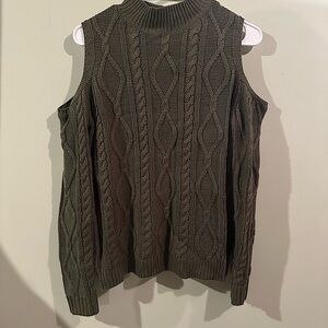 Olive green sweater, turtle neck, long sleeve, shoulders are cut out.